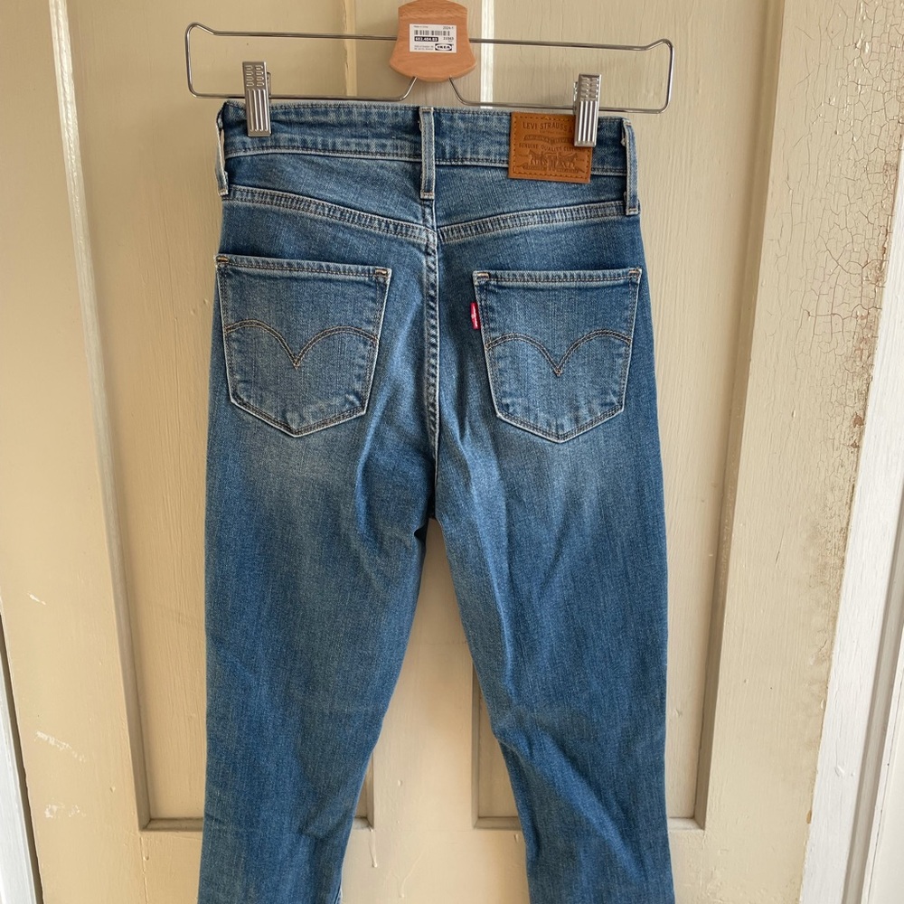 Levi’s ripped high rise jeans.